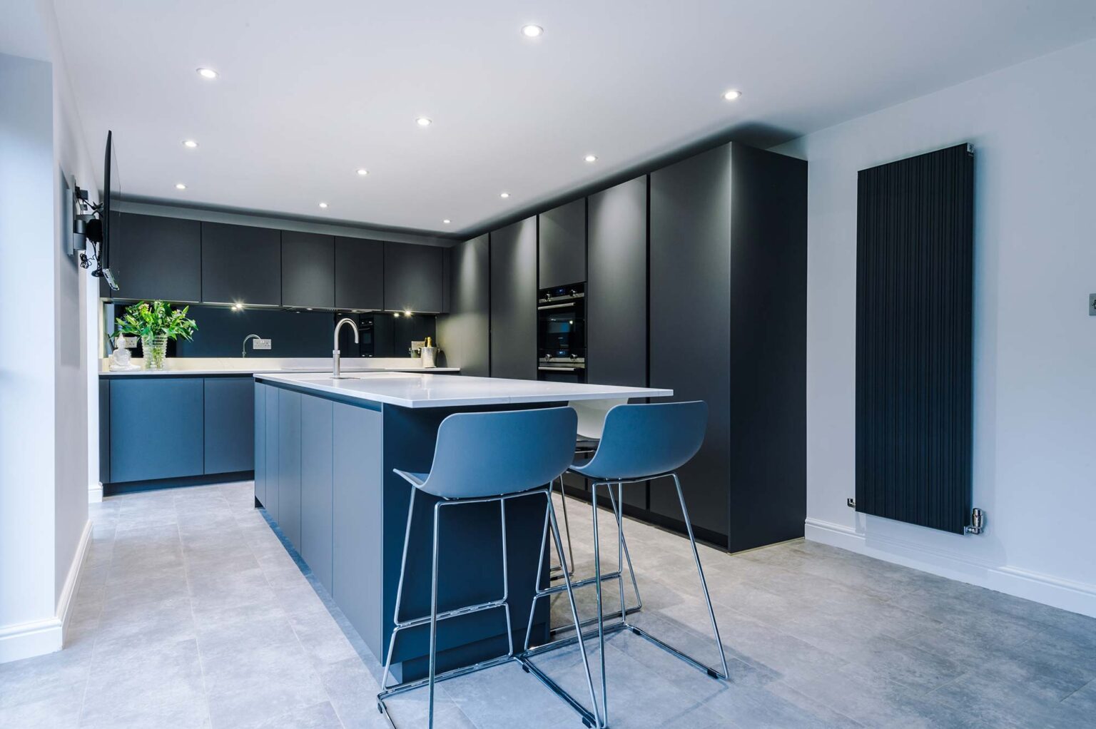 Professional property photograph of a blue / grey kitchen in Manchester